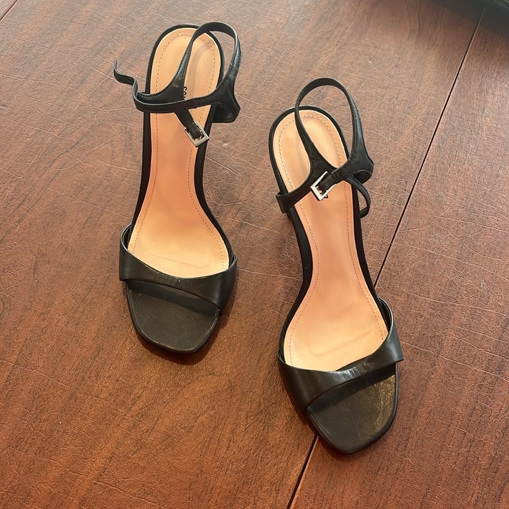 Schutz black sling back heel
